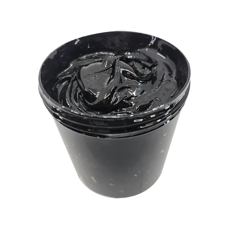 Black open-gear grease filling an open pot.