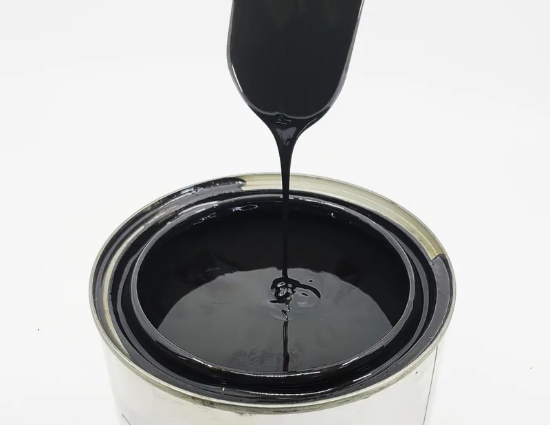 Black open-gear grease running off a blade into an open tin.